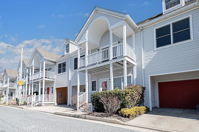 view of front of house featuring an attached garage and a residential view