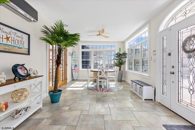 sunroom / solarium with a wall mounted AC