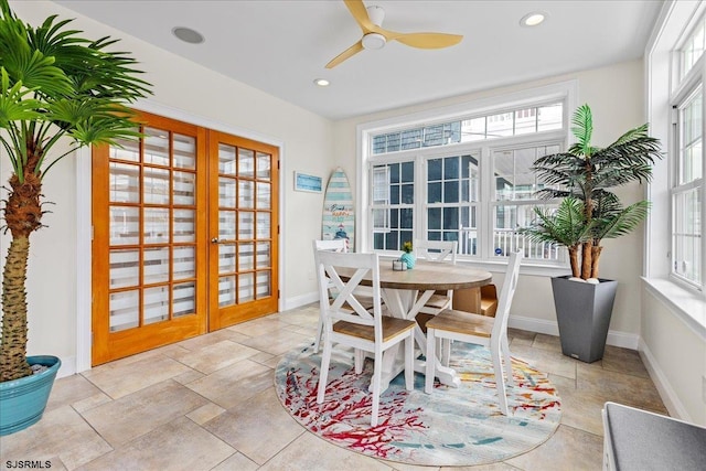 sunroom featuring french doors and ceiling fan