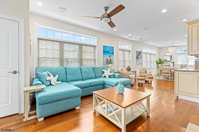 living room featuring recessed lighting, light wood-style floors, and a ceiling fan