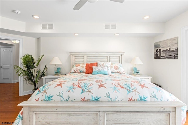 bedroom with dark wood finished floors, visible vents, recessed lighting, and ceiling fan