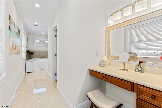 bathroom with visible vents, recessed lighting, tile patterned flooring, baseboards, and a bath