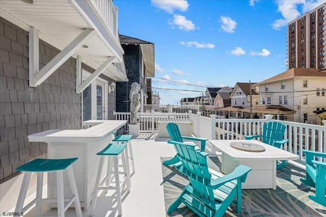 wooden terrace featuring outdoor dry bar