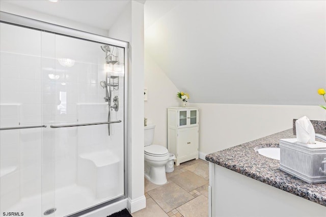 bathroom featuring a shower stall, baseboards, toilet, lofted ceiling, and vanity