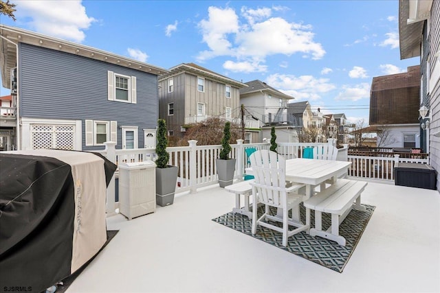 exterior space with outdoor dining space and grilling area