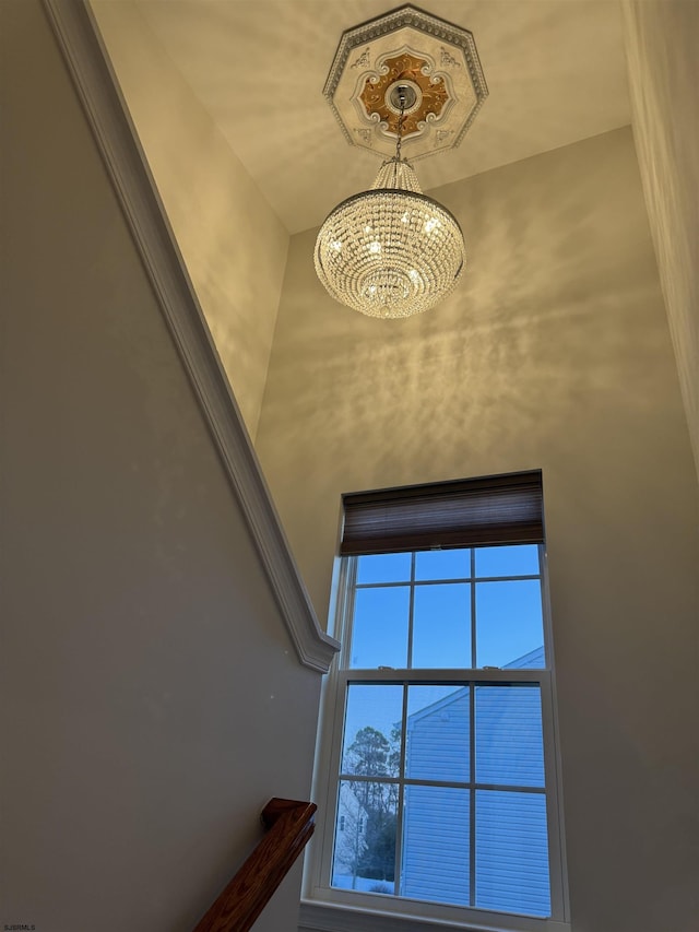 interior details featuring an inviting chandelier