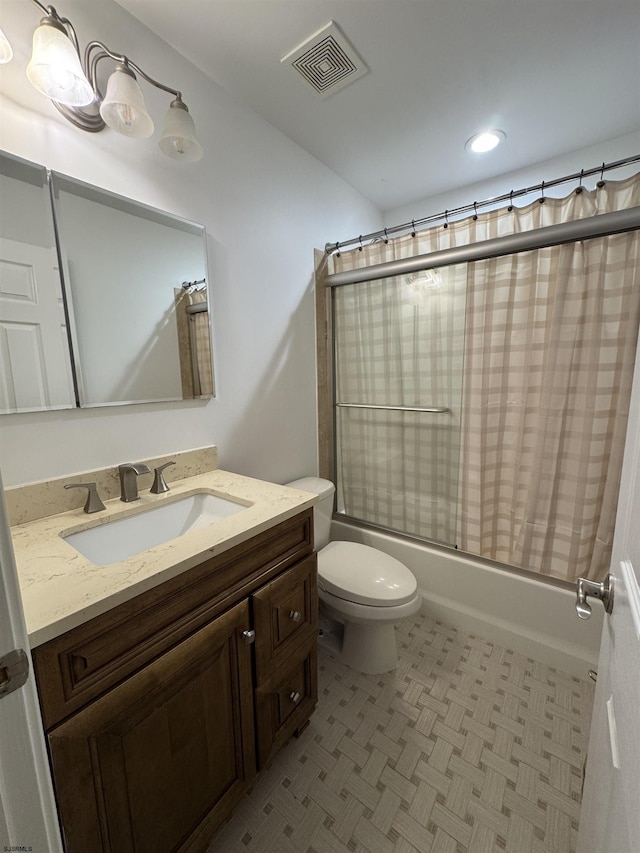 full bathroom featuring visible vents, shower / tub combo with curtain, vanity, and toilet