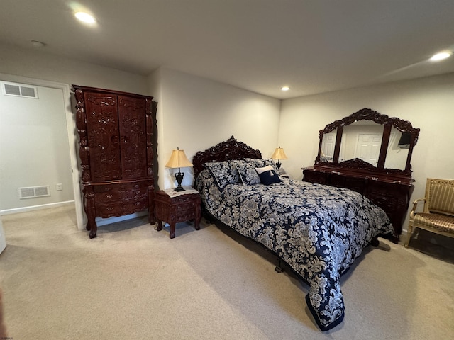 bedroom with light carpet, visible vents, and recessed lighting