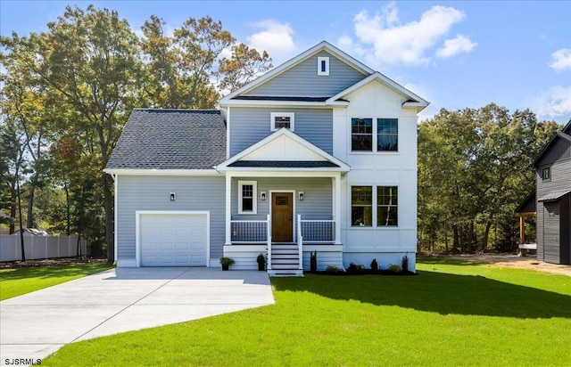 view of front of property featuring a front lawn, a porch, concrete driveway, roof with shingles, and a garage