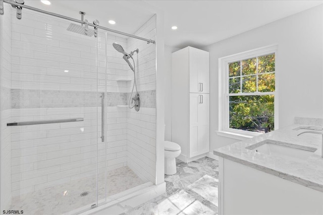 bathroom featuring a shower stall, toilet, recessed lighting, marble finish floor, and vanity