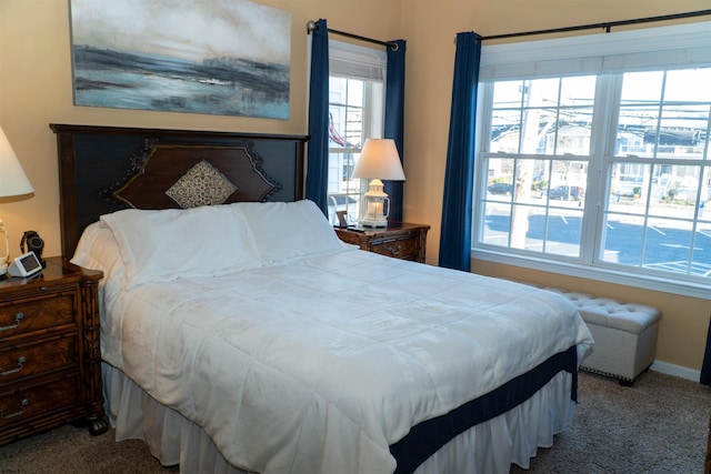 carpeted bedroom with baseboards