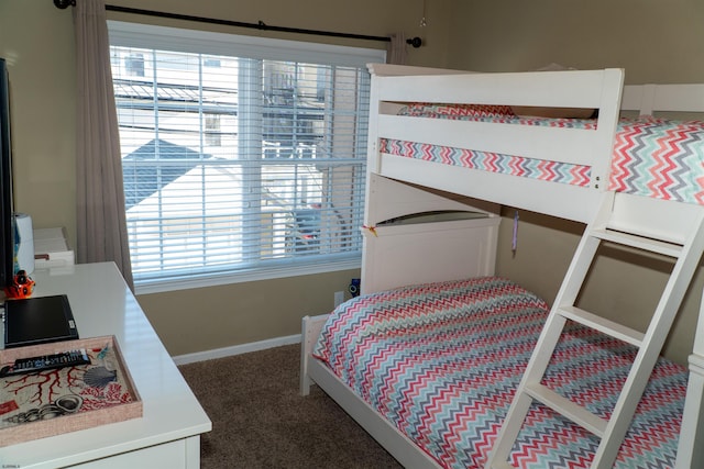 bedroom with carpet flooring and baseboards