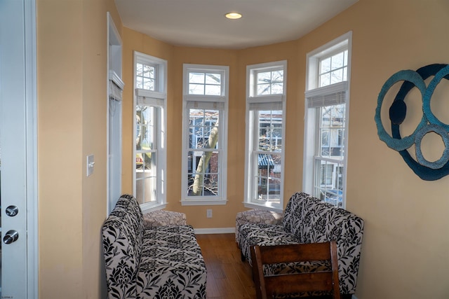 sitting room featuring recessed lighting, baseboards, plenty of natural light, and wood finished floors