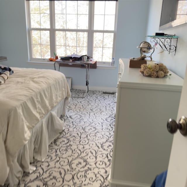 bedroom featuring baseboards