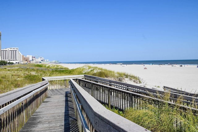 view of home's community featuring a view of the beach and a water view