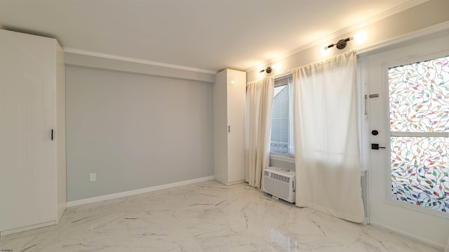 spare room with cooling unit, baseboards, marble finish floor, and crown molding