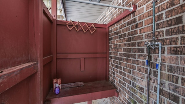 exterior space with brick siding