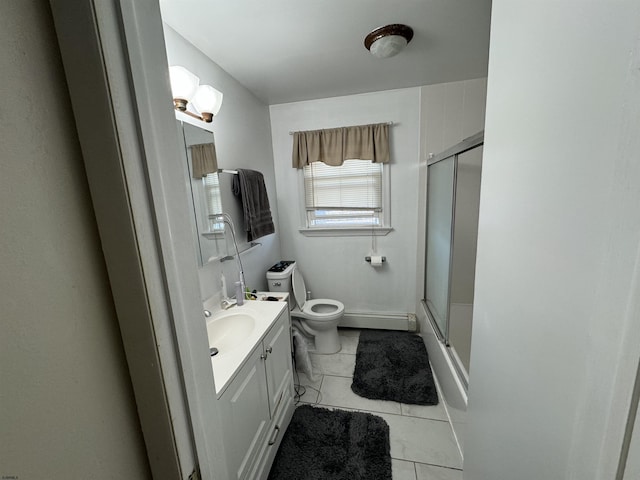 bathroom featuring vanity, toilet, an enclosed shower, and baseboard heating