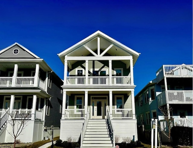 beach home featuring a porch and stairs