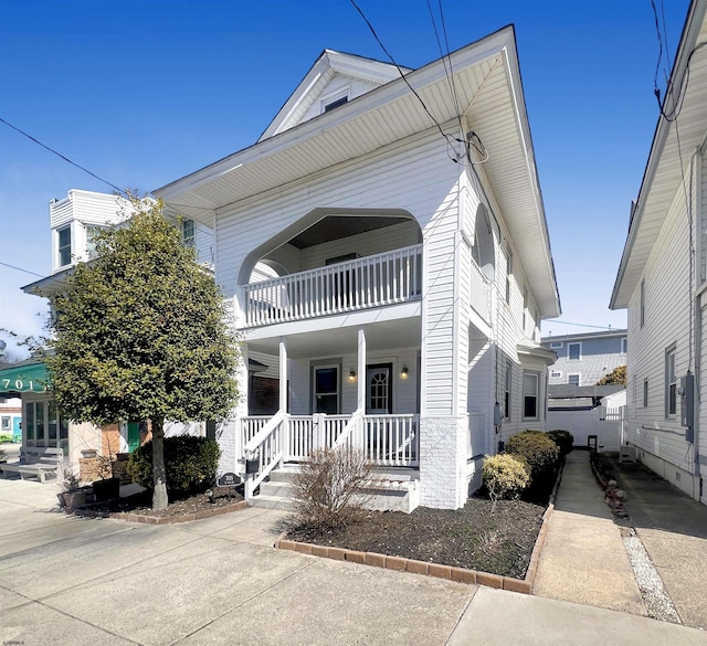 view of front of home with a balcony and covered porch