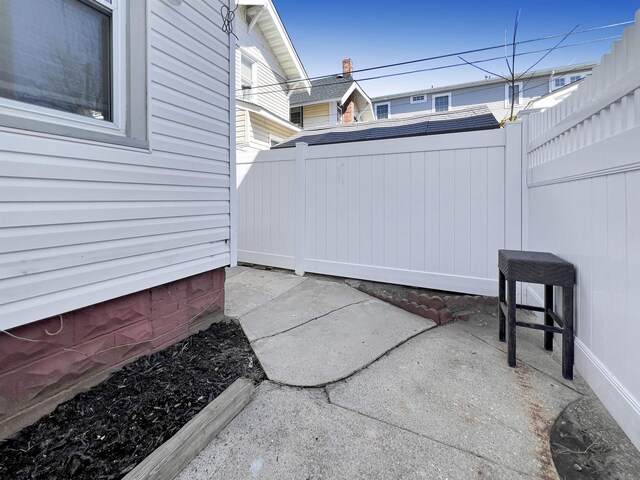 view of patio featuring fence