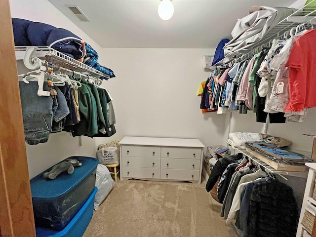 spacious closet with visible vents and carpet floors