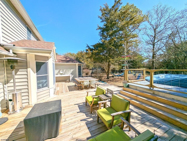 deck with outdoor dining space