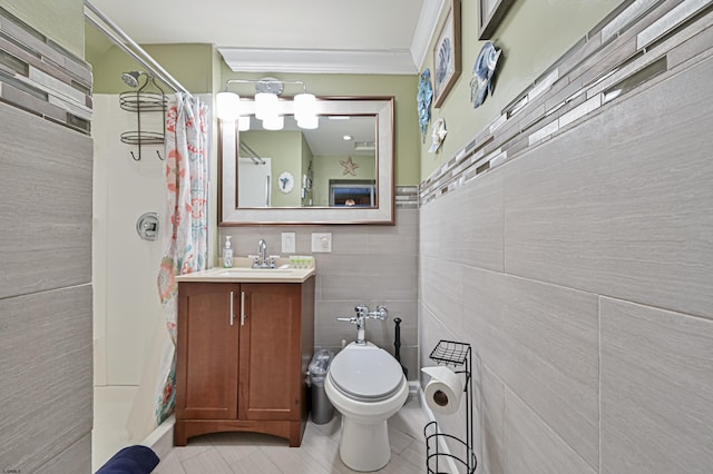 bathroom featuring tile patterned flooring, curtained shower, toilet, vanity, and tile walls