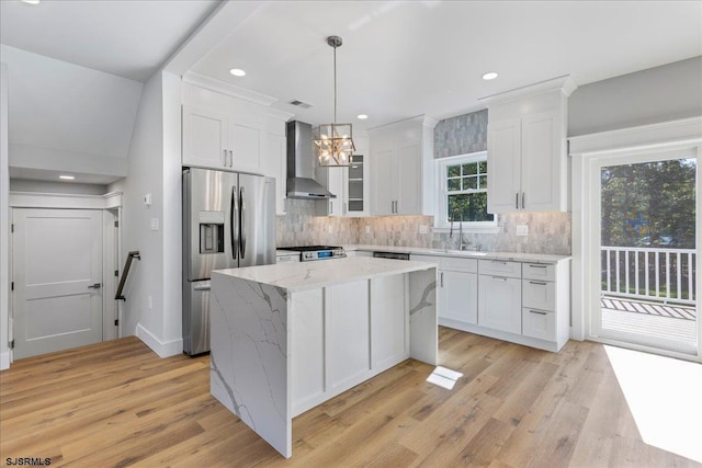 kitchen with backsplash, white cabinetry, stainless steel fridge with ice dispenser, wall chimney range hood, and range