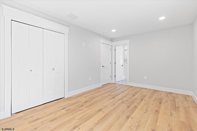 unfurnished bedroom featuring recessed lighting, baseboards, and light wood-style flooring