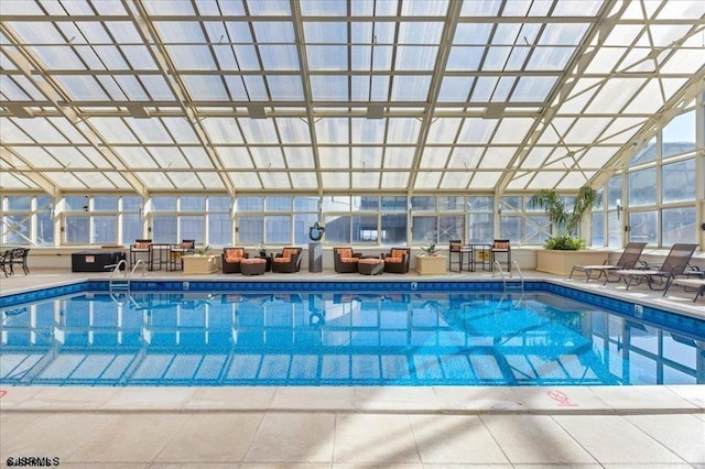 pool featuring a lanai and a patio area