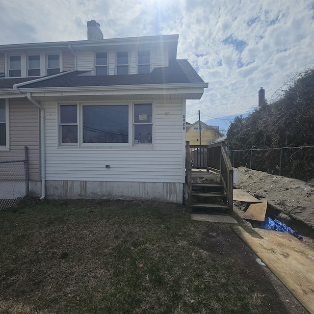 1428 Madison Ave, Venice Park, NJ 08401 - view of side of home with a lawn, fence, and a chimney