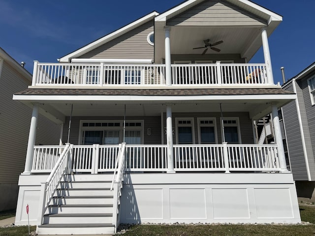 view of front of house with a balcony, a porch, and a ceiling fan