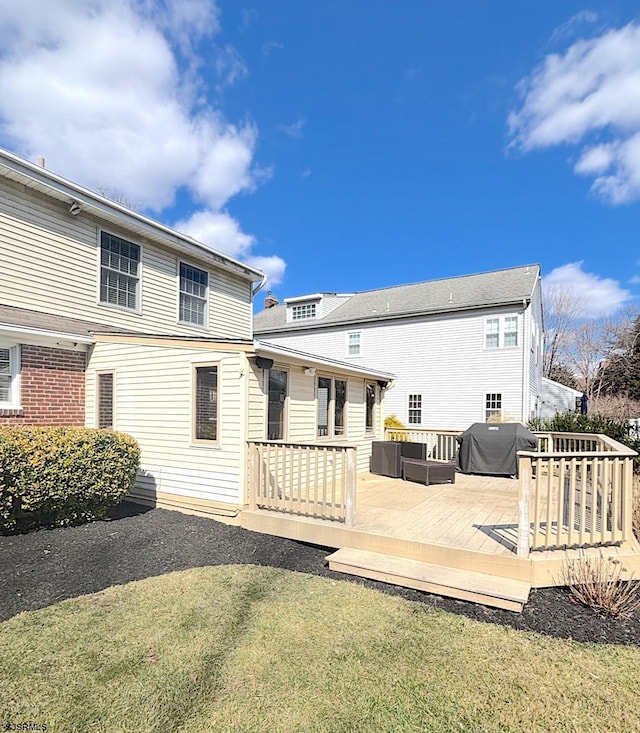 back of property featuring a deck