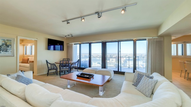 tiled living area featuring baseboards