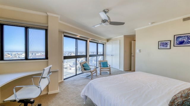 carpeted bedroom featuring ceiling fan, visible vents, ornamental molding, and built in study area