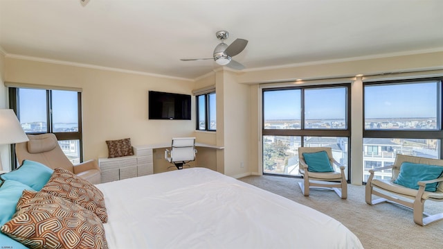 bedroom with baseboards, a ceiling fan, ornamental molding, and carpet flooring