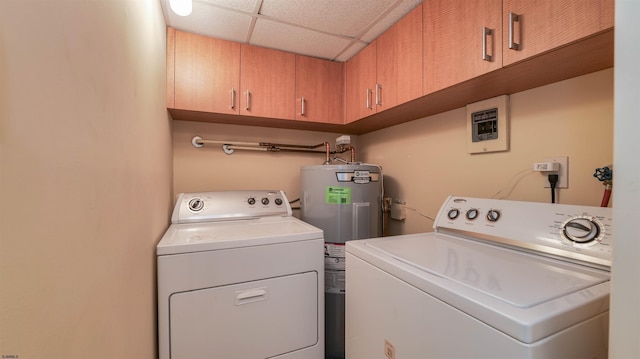 laundry area featuring washer and clothes dryer, cabinet space, and electric water heater