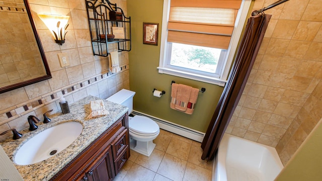 bathroom featuring toilet, tasteful backsplash, tile walls, baseboard heating, and vanity