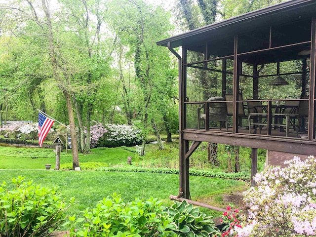 view of yard with a sunroom