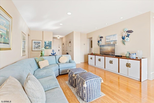 living room featuring recessed lighting and wood finished floors