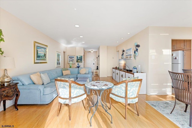 living area featuring recessed lighting and light wood finished floors