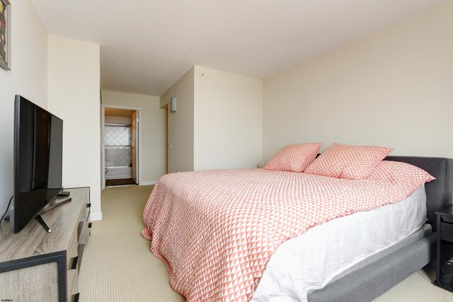 carpeted bedroom featuring baseboards