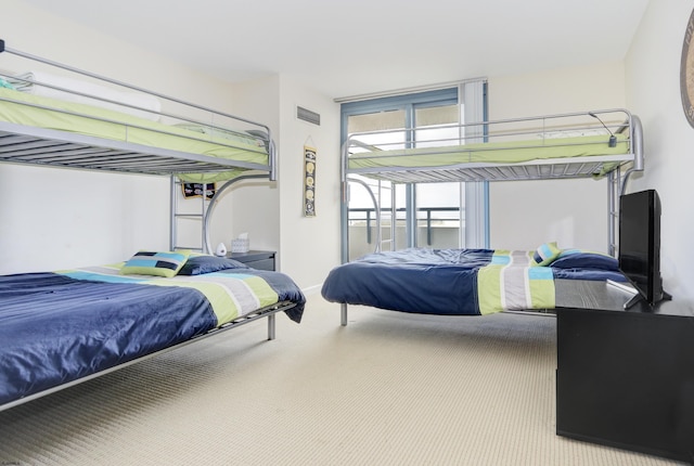 bedroom with visible vents and carpet floors