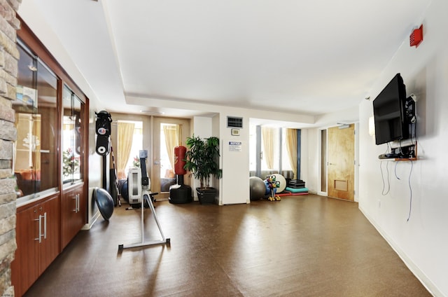 exercise area with visible vents and baseboards