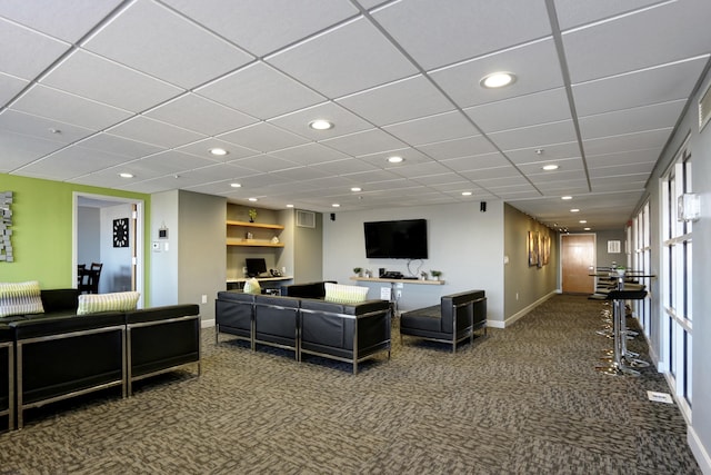 carpeted living area with visible vents, recessed lighting, and baseboards