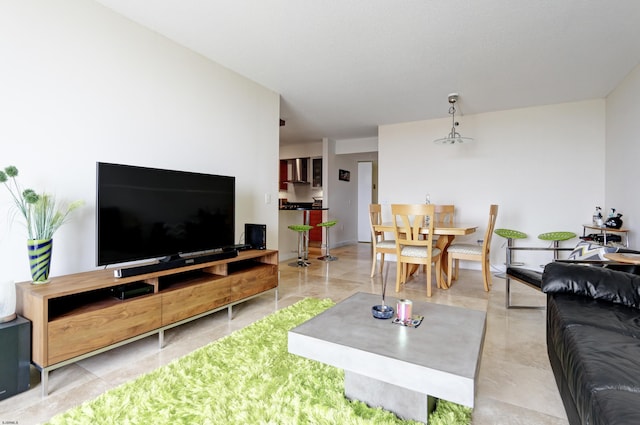 living area featuring baseboards