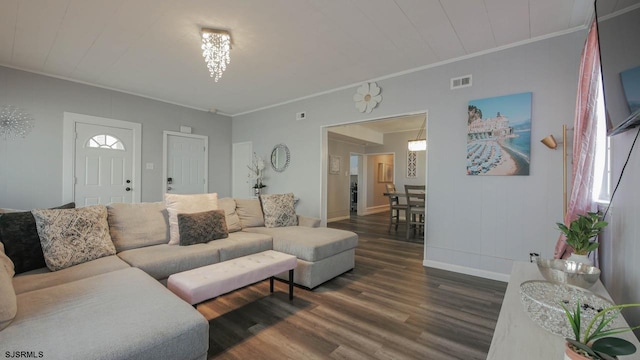 living room featuring baseboards, dark wood-style floors, visible vents, and ornamental molding