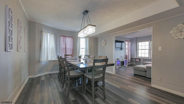 dining room featuring baseboards and dark wood-style floors