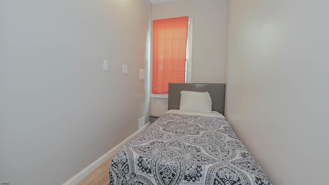 bedroom featuring baseboards